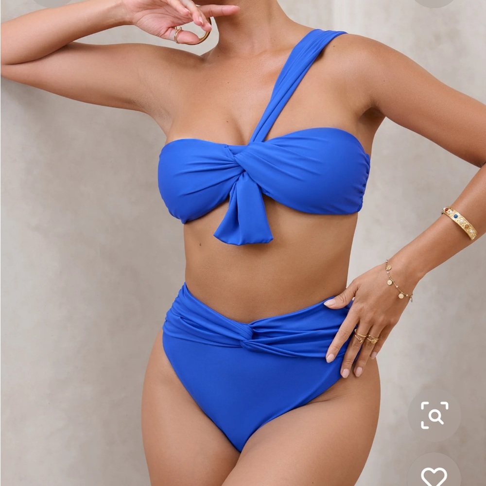 Two piece luxe bathing suit new with tags.